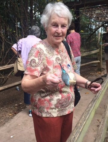 Image of LLP trip participant holding a beautiful bird on a trip to the Duke Gardens